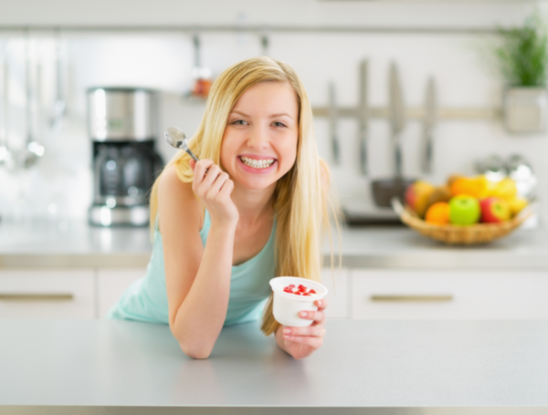 Woman eating yogurt