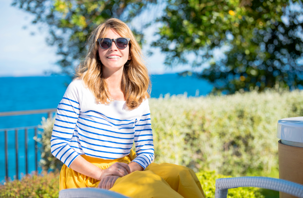 Woman sitting outdoor with nature