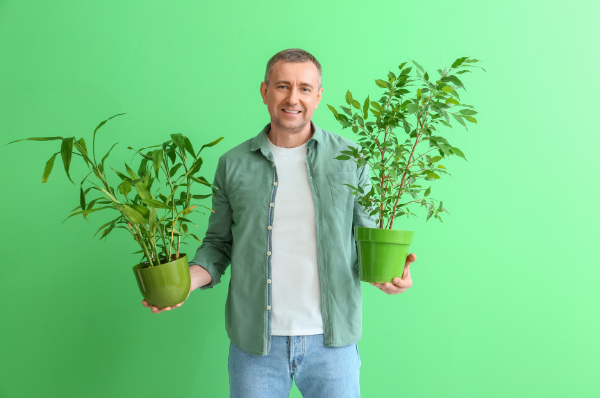 Houseplant dad holding potted babies